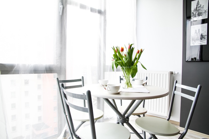 bistro table in front of a bright window