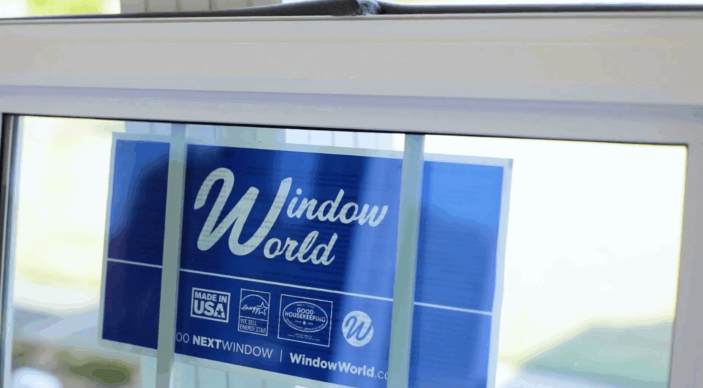 Sticker on window with Window World logo on it